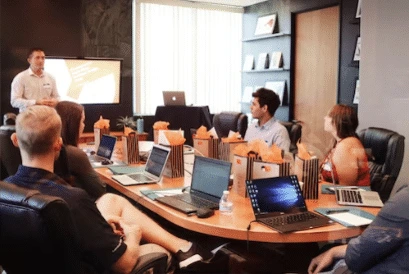 This image shows finance and marketing experts discussing and building strategies.