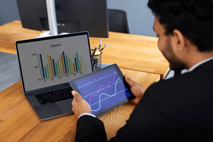 Business person looking finance graphs 23 2150461313
