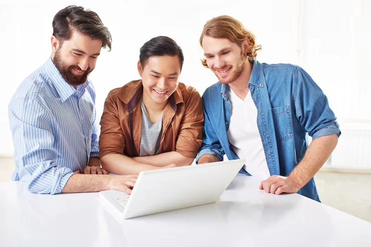 CRM setup and sales automation team configuring customer relationship management systems on laptop