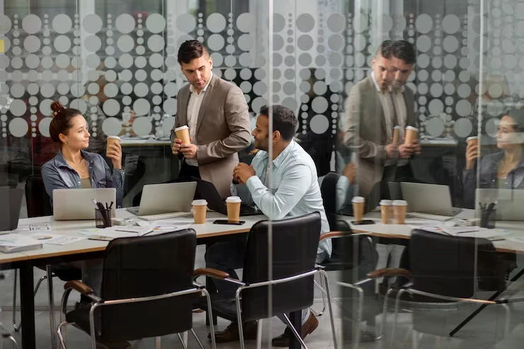 Business professionals discussing co-registration and live transfer lead processes in modern office meeting space
