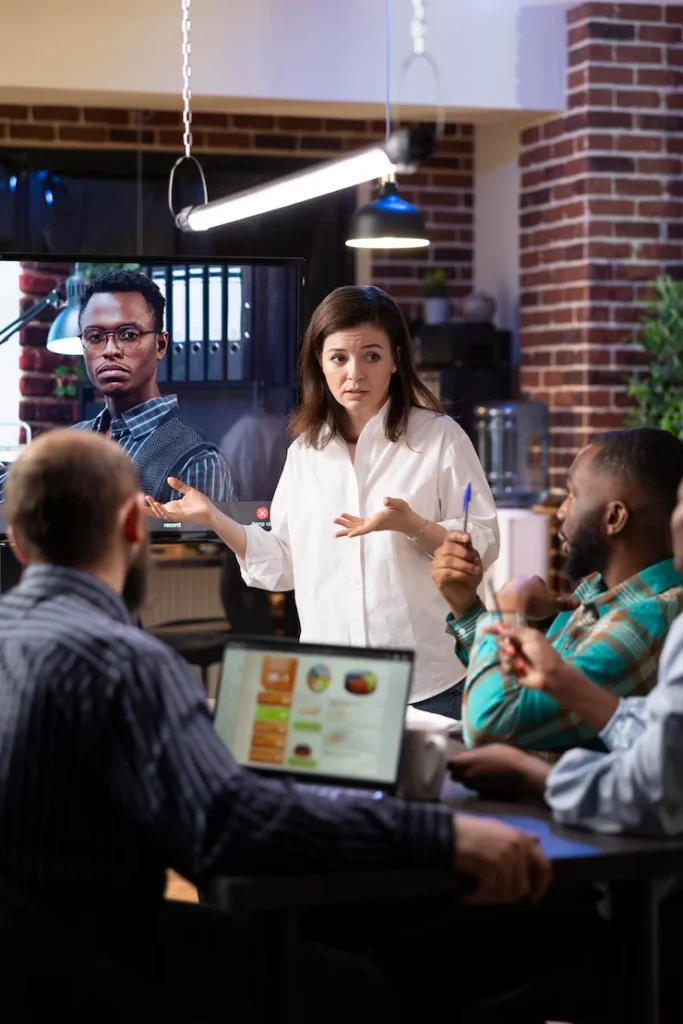 Marketing team discussing cold email campaign strategies for annuity leads in collaborative office meeting