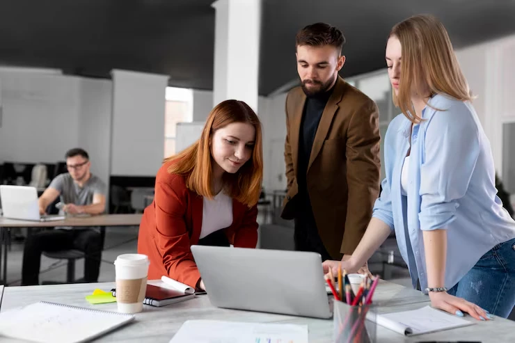 Professional team reviewing verified appointment setting process on laptop in modern office workspace