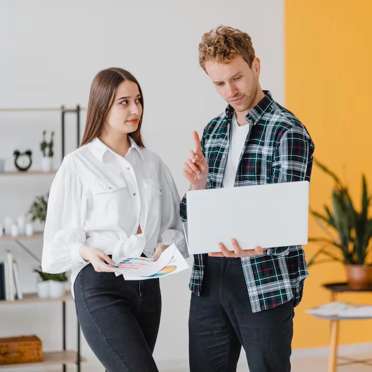 Business professional presenting conversion optimization strategy on laptop while colleague reviews performance metrics